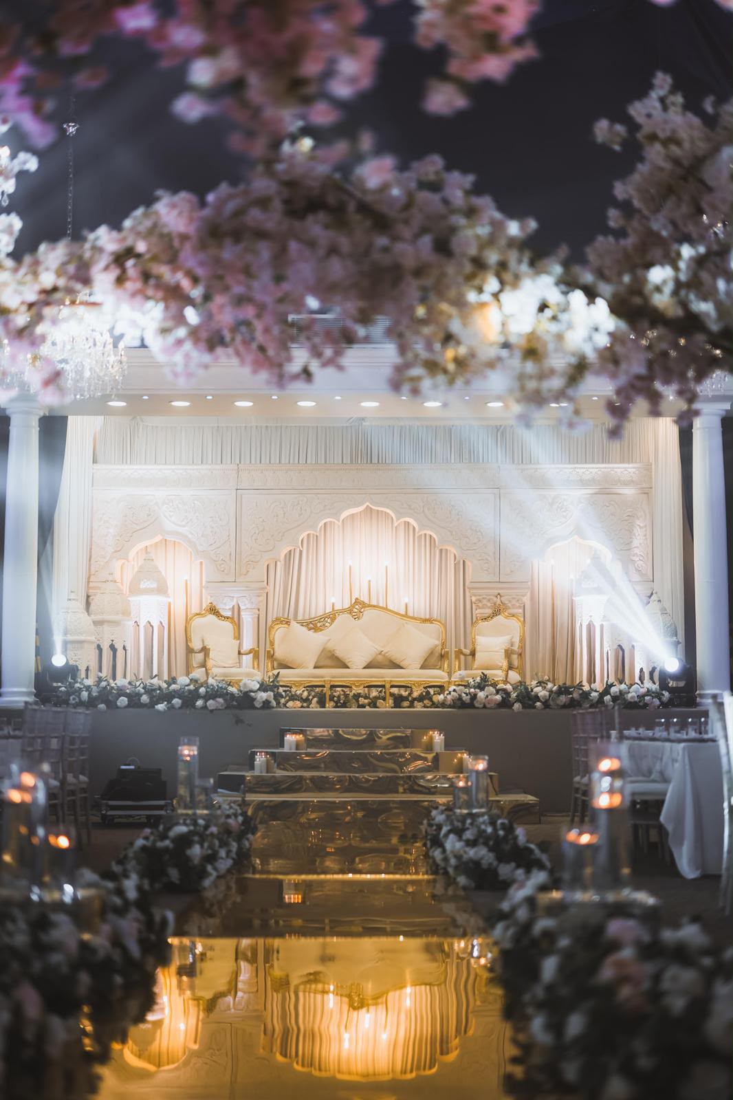 Luxury floral centrepiece and chandeliers at Wilton Hall event venue