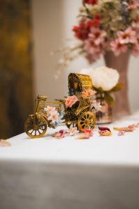 Elegant wedding stage with gold-framed seating at Wilton Hall, Milton Keynes
