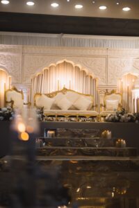 Wedding stage and aisle setup with candlelit steps at Wilton Hall